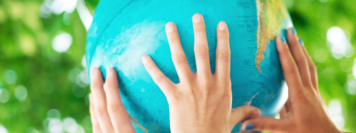 iStock-502605445-Holding-Globe iStock-502605445-Holding-Globe